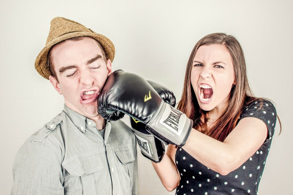 Photo of Woman Punching Man in Face